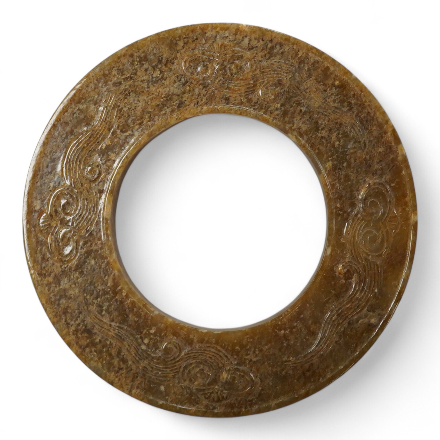 A Chinese russet jade dragon disc, 5.5cm diameter